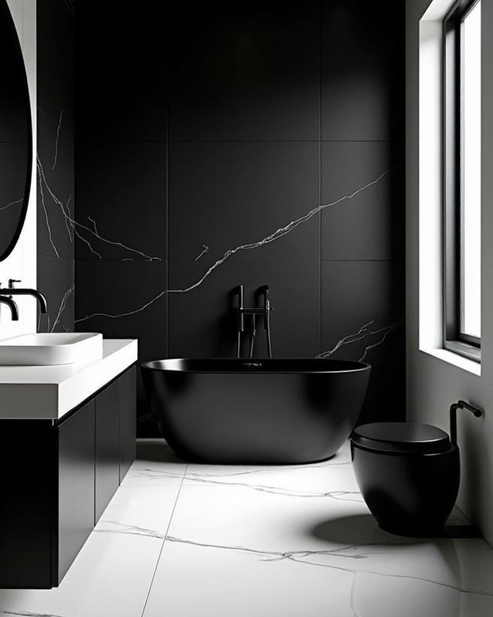 Black marble-effect bathroom with freestanding bath